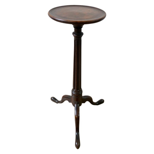 93 - GEORGE III OAK WINE TABLE18TH CENTURYthe circular dish top raised on a fluted column support, ending... 