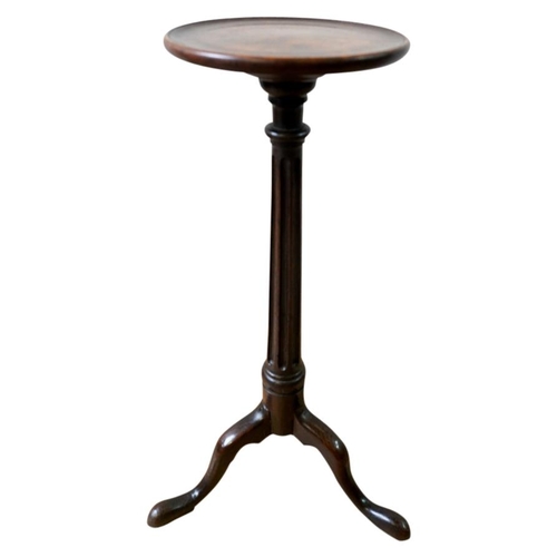 93 - GEORGE III OAK WINE TABLE18TH CENTURYthe circular dish top raised on a fluted column support, ending... 