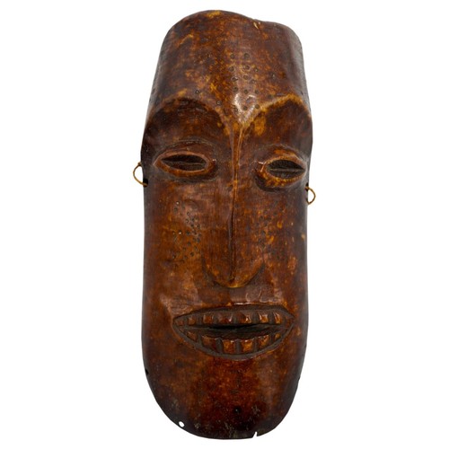 409 - AN AFRICAN IVORY LEGA TRIBE MASK FROM ZAIRE, late 19th century, of plain form, with ovoid eyes and d... 