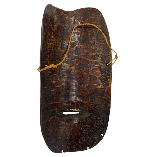 409 - AN AFRICAN IVORY LEGA TRIBE MASK FROM ZAIRE, late 19th century, of plain form, with ovoid eyes and d... 