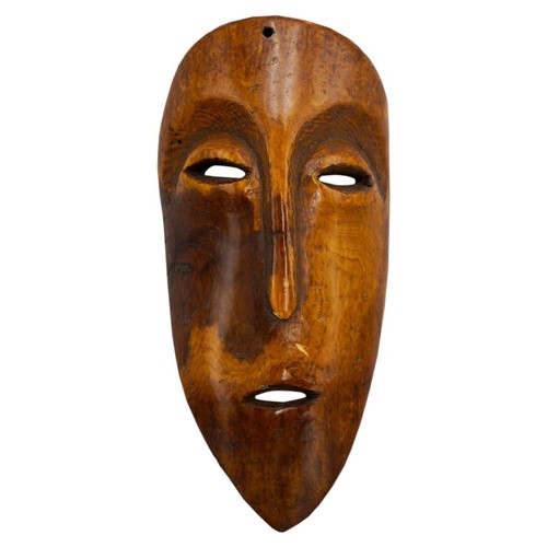 410 - AN AFRICAN IVORY LEGA TRIBAL MASK, FROM ZAIRE, late 19th century, of plain form with ovoid eyes, elo... 