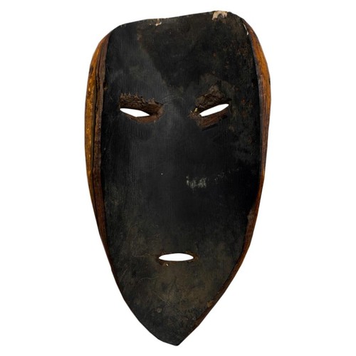 410 - AN AFRICAN IVORY LEGA TRIBAL MASK, FROM ZAIRE, late 19th century, of plain form with ovoid eyes, elo... 