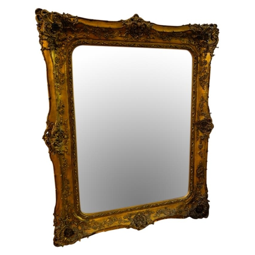 230A - LARGE GILT FRAMED WALL MIRRORthe rectangular plate within an ornate rococo carved frame164cm x 131cm... 