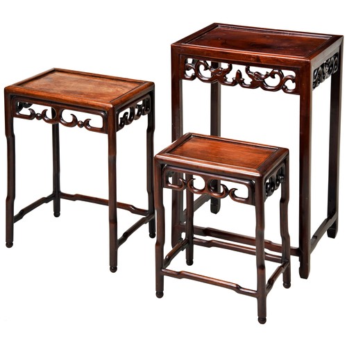 113 - NEST OF THREE CHINESE HARDWOOD TABLESQING DYNASTY, LATE 19TH CENTURYwith rectangular tops and open s... 