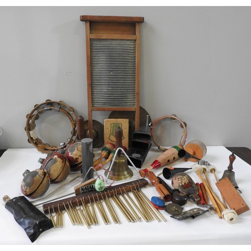 58 - A SELECTION OF VINTAGE PERCUSSION INSTRUMENTS to include cowbells, tambourines, a Kalimba, four... 