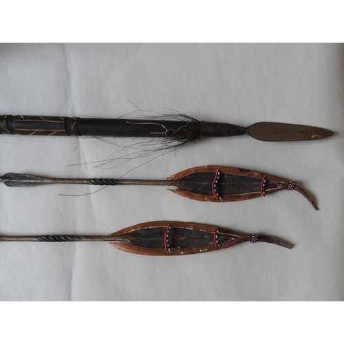 256 - A COLLECTION OF KENYAN 20TH CENTURY CARVED TRIBAL WARES, including mask, spears and walking sticks (... 