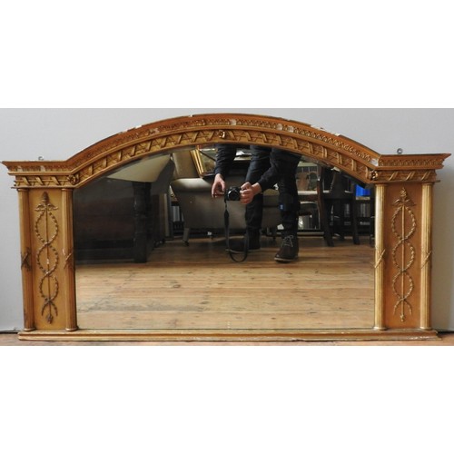 273 - A VICTORIAN GILT GESSO OVERMANTEL MIRROR, the arched top late flanked by two panels with reeded colu... 