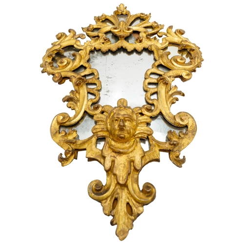 274 - GOOD ITALIAN CARVED GILTWOOD MIRROR18TH CENTURYthe sectional mirrored plates within an ornate carved... 