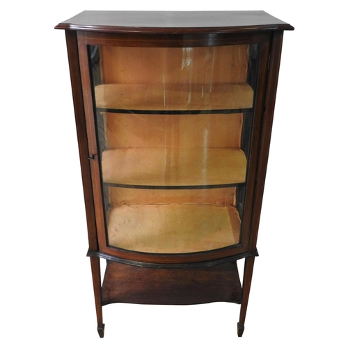 4 - A LATE 19TH CENTURY MAHOGANY INLAID BOW FRONT DISPLAY CABINET, on tapered legs with three internal s... 