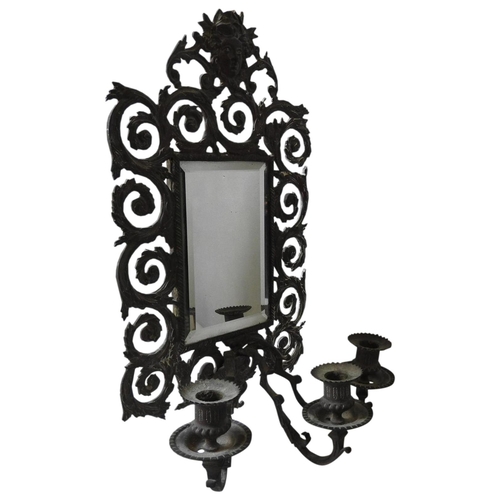 259 - AN ORNATE 19TH CENTURY BRASS TRIPLE BRANCH MIRROR BACK WALL SCONCE, decorated with pierced scroll wo... 