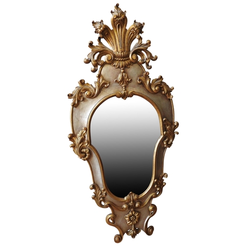 266 - A LARGE 20TH CENTURY CONTINENTAL STYLE WALL GILDED MIRROR, the roccoco style tapered frame decorated... 