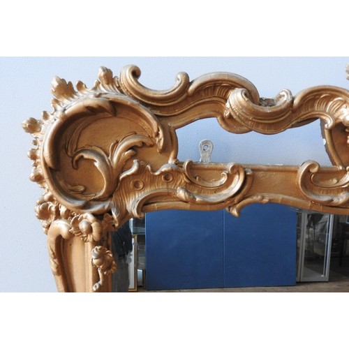 264 - AN ORNATE GILT FRAMED OVER MANTEL MIRROR  WITH FLORAL DECORATION AND PORTRAIT PANEL, 156 x 122 x 8cm