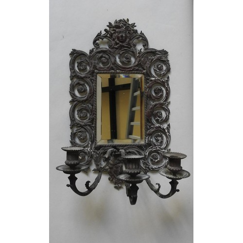 259 - AN ORNATE 19TH CENTURY BRASS TRIPLE BRANCH MIRROR BACK WALL SCONCE, decorated with pierced scroll wo... 