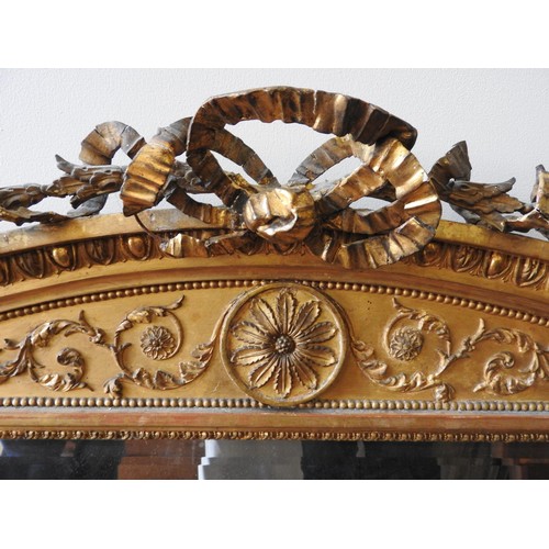 272 - A LARGE 19TH CENTURY GILT GESSO OVERMANTEL MIRROR, of rectangular form, the arched pediment with a r... 