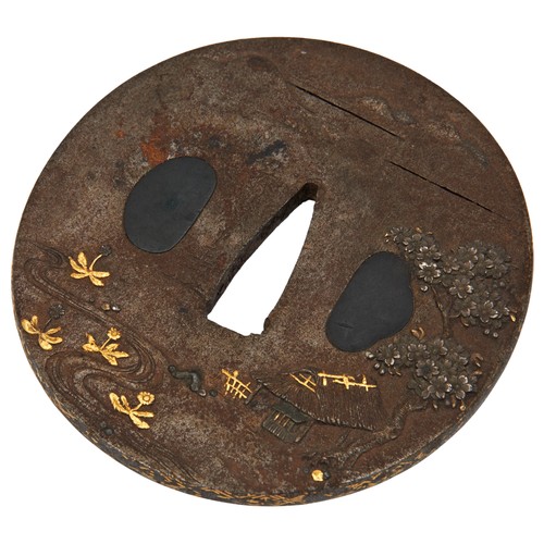 325 - JAPANESE IRON AND MIXED METAL TSUBAEDO PERIODdecorated in relief with a bridge and a straw hut besid... 