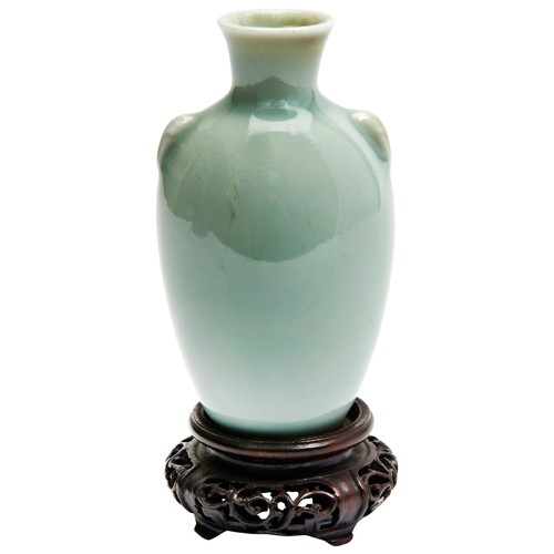 110 - SMALL CELADON VASEQING DYNASTY, 19TH CENTURYof baluster form, raised on a carved hardwood stand10cm ... 