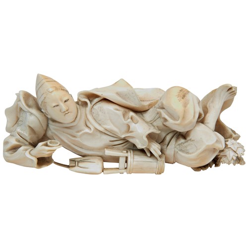 336 - A JAPANESE 19TH CENTURY IVORY OKIMONO OF A RECLINING MALE FIGURE, poised with a tea bowl in his righ... 