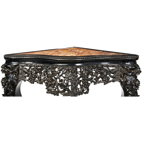 298 - CARVED HARDWWOD MARBLE INSET CORNER TABLEQING DYNASTY, 19TH CENTURYthe serpentine shaped top above a... 