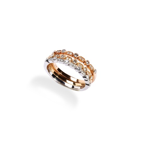 61 - THREE CONTEMPORARY DIAMOND STACKING RINGS each set with millegrain set single and pairs of brilliant... 