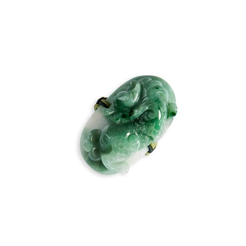 105 - TWO CARVED JADEITE RINGSA white and green coloured jadeite ring in the form of a carved dragon on a ... 