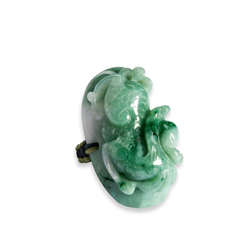 105 - TWO CARVED JADEITE RINGSA white and green coloured jadeite ring in the form of a carved dragon on a ... 