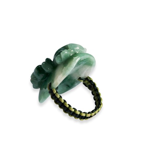 105 - TWO CARVED JADEITE RINGSA white and green coloured jadeite ring in the form of a carved dragon on a ... 