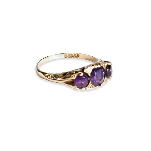 123 - AMETHYST AND DIAMOND RING Three amythyst and four diamond highlights set in a carved head.Size P 1/2... 