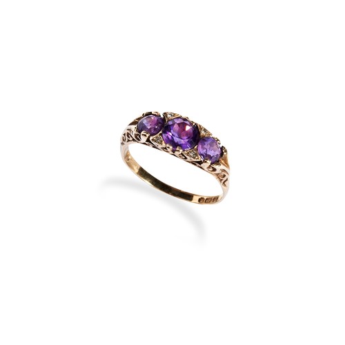 123 - AMETHYST AND DIAMOND RING Three amythyst and four diamond highlights set in a carved head.Size P 1/2... 