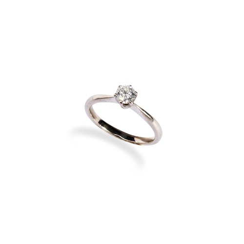 119 - A SINGLE STONE DIAMOND RING with a claw set diamond between a tapering shank. Set in white metal. Ri... 