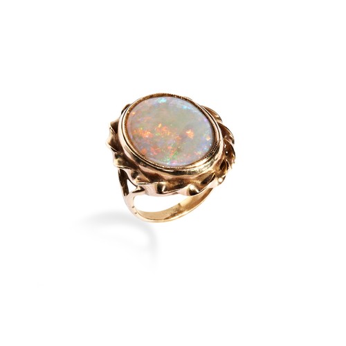 120 - AN OPAL RING the oval cabochon-cut opal set within a twisted border and split shank. Ring size I. Un... 