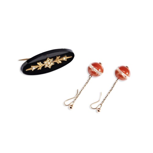 77 - A PAIR OF LATE NINETEENTH CENTURY CARNELIAN AND ROCK CRYSTAL EARRINGS suspended from chains on sheph... 