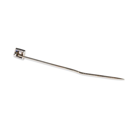 64 - A DIAMOND AND SAPPHIRE TIE PIN, CIRCA 1900 the step-cut diamond collet set within a border of fancy-... 