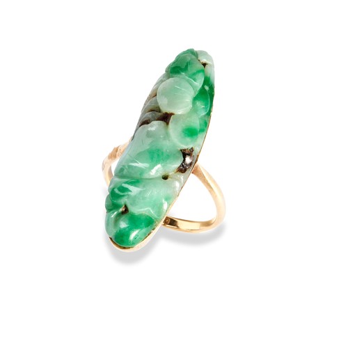 95 - A JADEITE RING  the apple green oval carved jadeite plaque, set in a simple gold mount with tapering... 