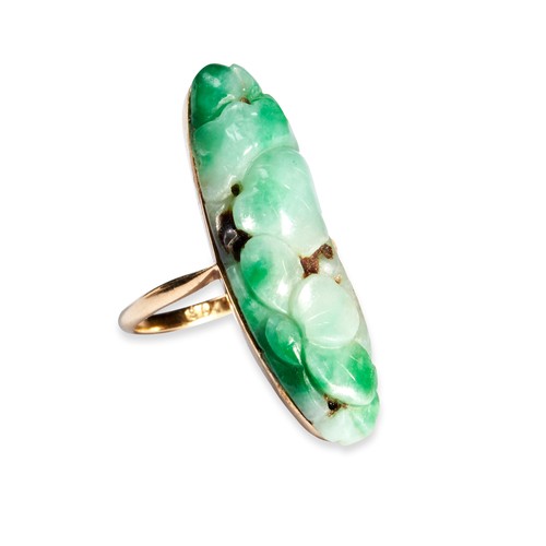 95 - A JADEITE RING  the apple green oval carved jadeite plaque, set in a simple gold mount with tapering... 