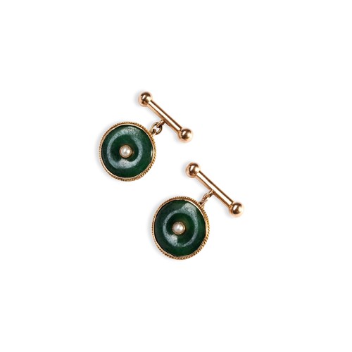 73 - A PAIR OF NEPHRITE, PEARL AND GOLD CUFFLINKS the circular disc collet set to the centre with a half ... 