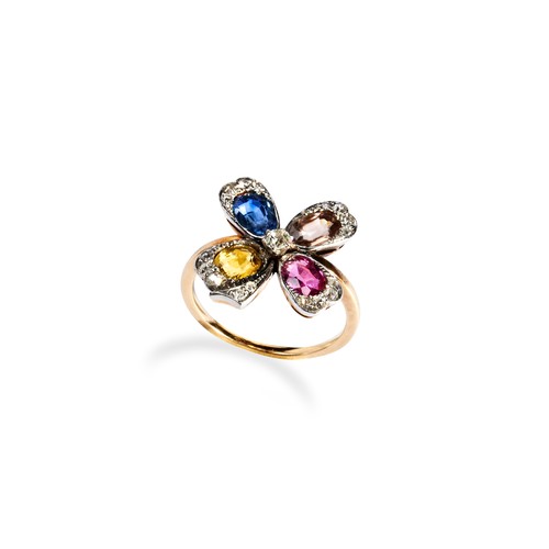 143 - A SAPPHIRE AND DIAMOND RING, CIRCA 1900 the flower head set with a single blue, yellow or peach oval... 