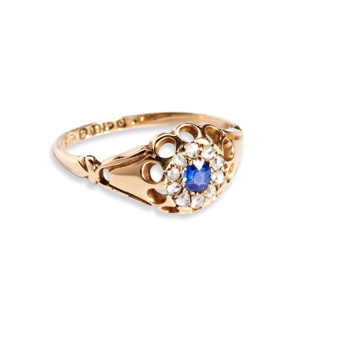 135 - A VICTORIAN SAPPHIRE AND DIAMOND CLUSTER RING the cushion-cut sapphire claw set within a bezel of te... 