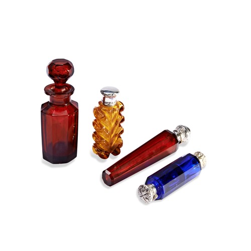 252 - A COLLECTION OF GLASS PERFUME BOTTLEOne cut glass with glass stopper, one double ended blue glass wi... 