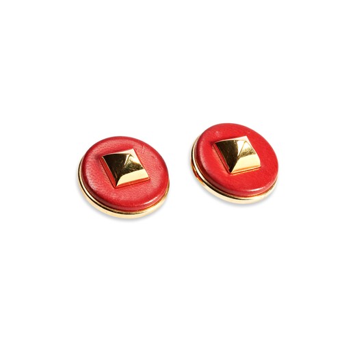 113 - A PAIR OF RED LEATHER HERMES MEDOR EARRINGSHermes gilt metal & red leather 'Medor' Clip On Earri... 