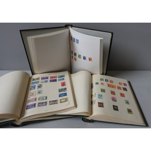 319 - A COLLECTION OF THREE STAMP ALBUMS INCLUDING A VICTORIAN PENNY RED AND OTHERS