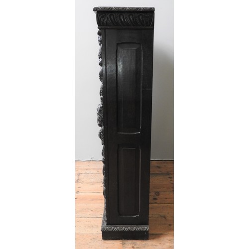 17 - AN ORNATE CARVED OAK 19TH CENTURY BOOKCASE, with three adjustable shelves, a central lobe carved fri... 