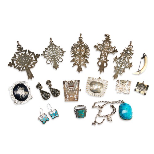 504 - A QUANTITY OF ETHNIC JEWELLERYIncluding five white metal stylised crosses, possibly Ethiopian, South... 