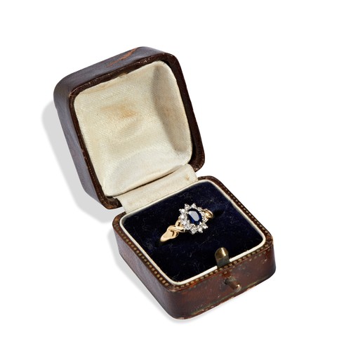 509 - A SAPPHIRE AND DIAMOND 18CT GOLD RINGSapphire measures 4.2mm x 5.8mm and 2.5mm deep, surrounded by 1... 