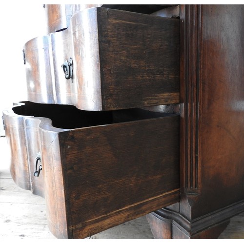 40 - AN EDWARDIAN WALNUT AND MAHOGANY SERPENTINE CHEST OF DRAWERS, in a George II style , with an inlaid ... 