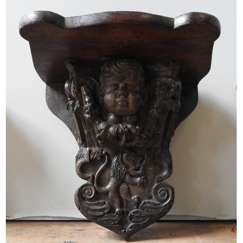 41 - AN 18TH CENTURY CARVED OAK CORBEL AND TWO CONTEMPORARY WALL NICHES, the oak corbel decorated with he... 