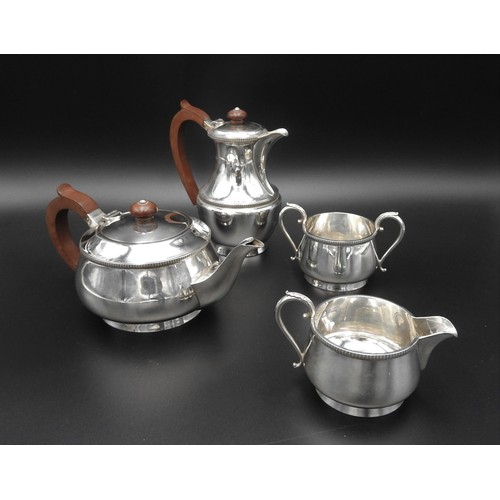 450 - A 20TH CENTURY FOUR PIECE SILVER TEA SERVICE, comprising of tea pot, hot water jug, milk jug and sug... 