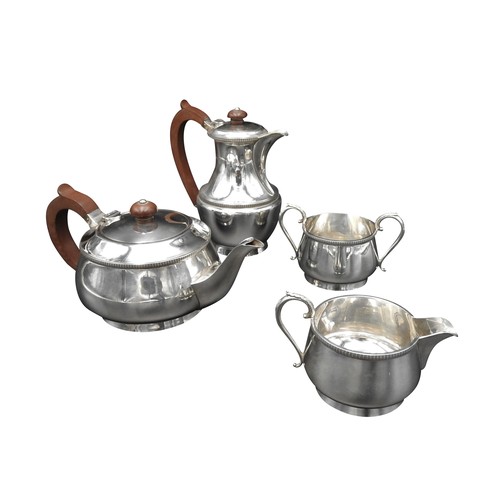 450 - A 20TH CENTURY FOUR PIECE SILVER TEA SERVICE, comprising of tea pot, hot water jug, milk jug and sug... 