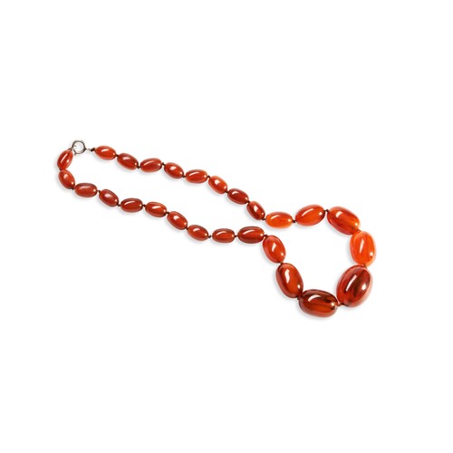 531 - A QUANTITY OF NECKLACESTwo dark orange graduating beaded bakelite necklaces. Together with three ora... 