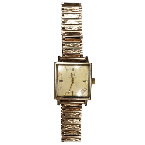 487 - A VINTAGE ZENITH AUTOMATIC 9CT GOLD WRIST WATCH, circa 1968, the square face with date window in bot... 