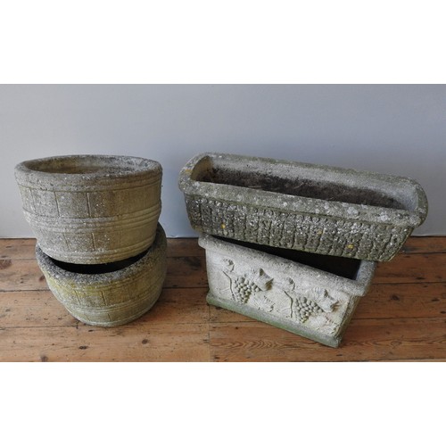 141 - A PAIR OF RECONSTITUTED STONE BARREL STYLE GARDEN TUBS AND TWO TROUGHS, the deeper trough decorated ... 